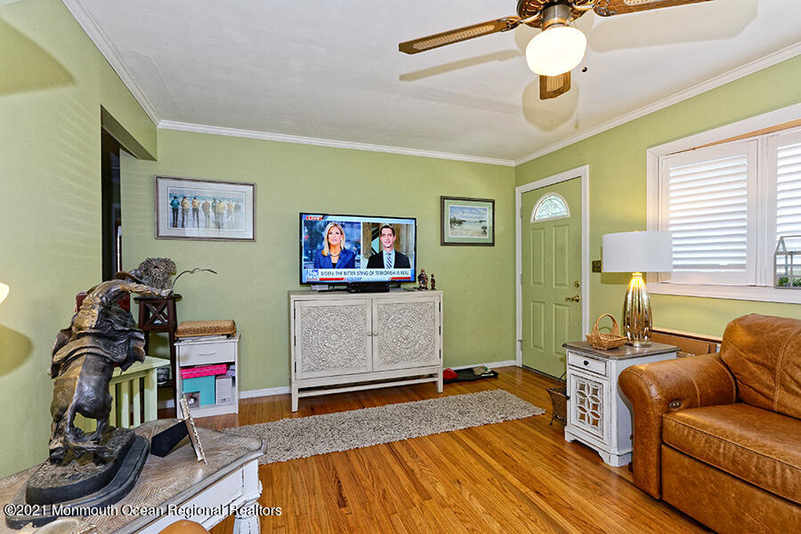 458 Dover Road Toms River, NJ 08757 - Photo 6 of 13 a bedroom with furniture and a flat screen tv