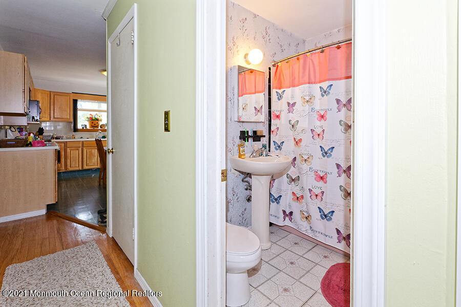 458 Dover Road Toms River, NJ 08757 - Photo 10 of 13 a bathroom with a sink toilet and shower