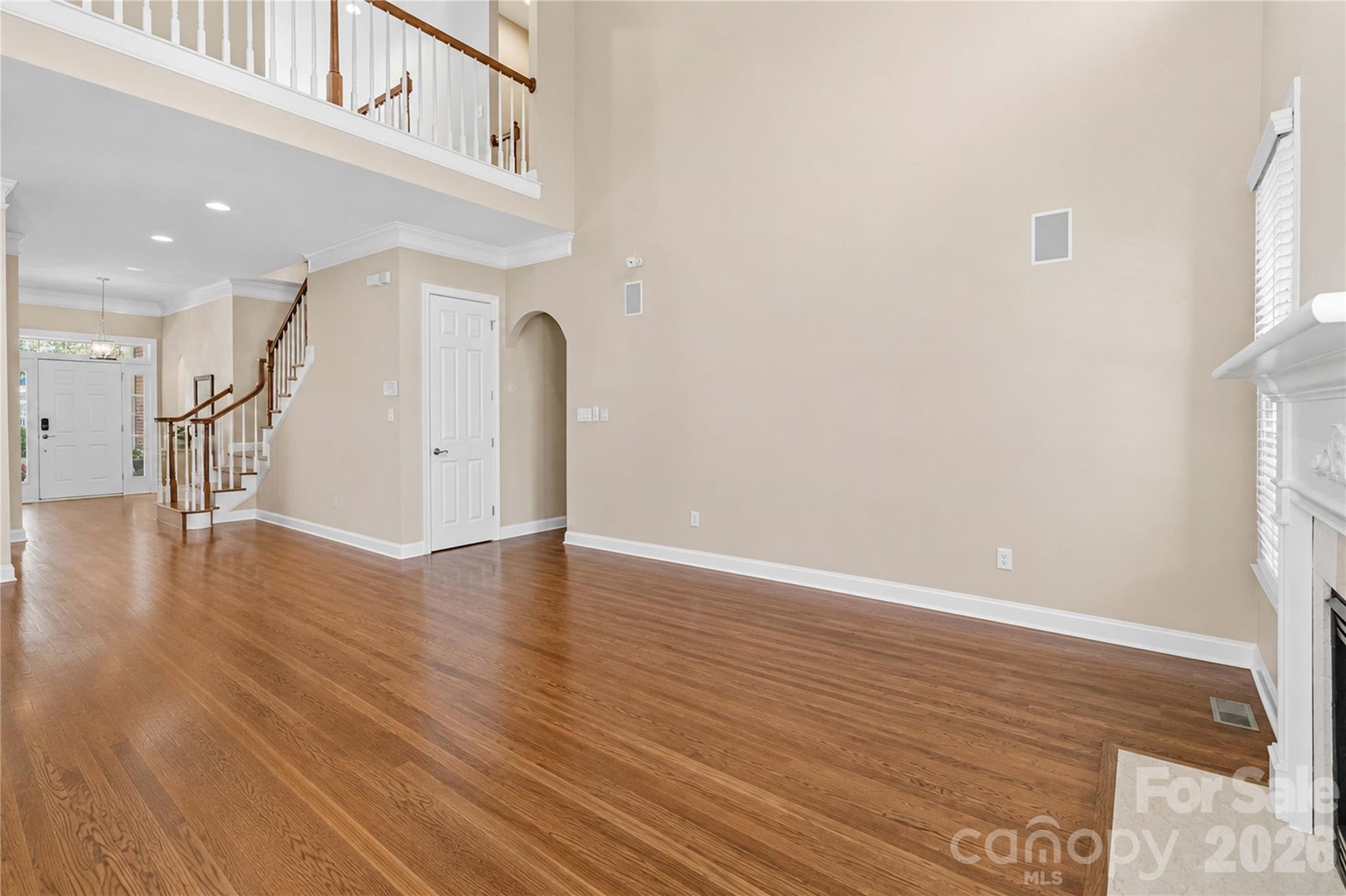 2436 Commons Court Fort Mill, SC 29708 - Photo 8 of 43 a view of an empty room with wooden floor