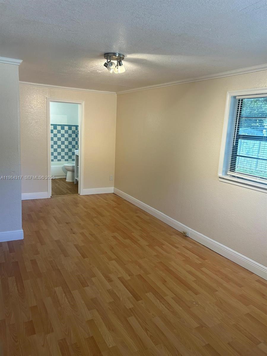 8866 Southwest 126th Street Miami, FL 33176 - Photo 5 of 20 a view of an empty room with a window