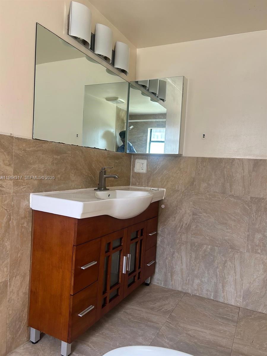 8866 Southwest 126th Street Miami, FL 33176 - Photo 10 of 20 a bathroom with a sink and a mirror