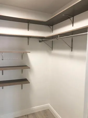 a view of a room with racks on the wall