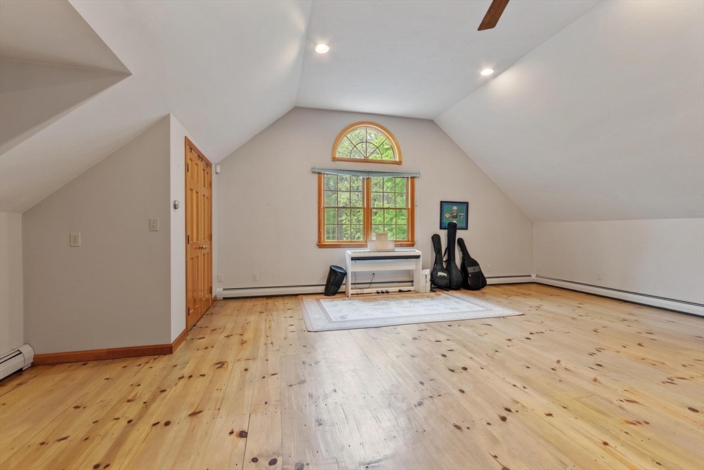 94 Turner Road Townsend, MA 01469 - Photo 17 of 42 a view of a big room with wooden floor and windows