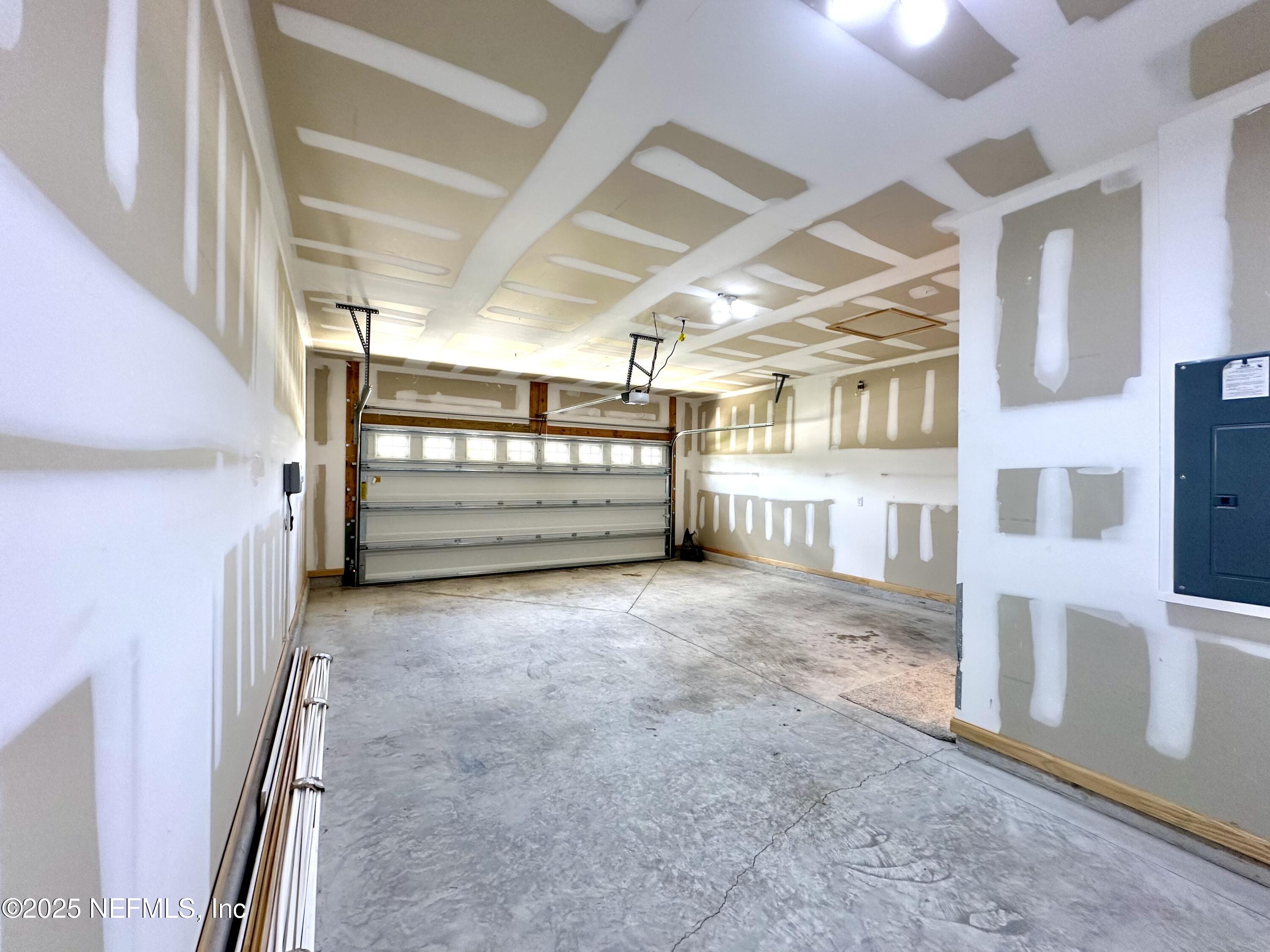 75310 White Rabbit Avenue Yulee, FL 32097 - Photo 42 of 61 a view of an empty room with a window