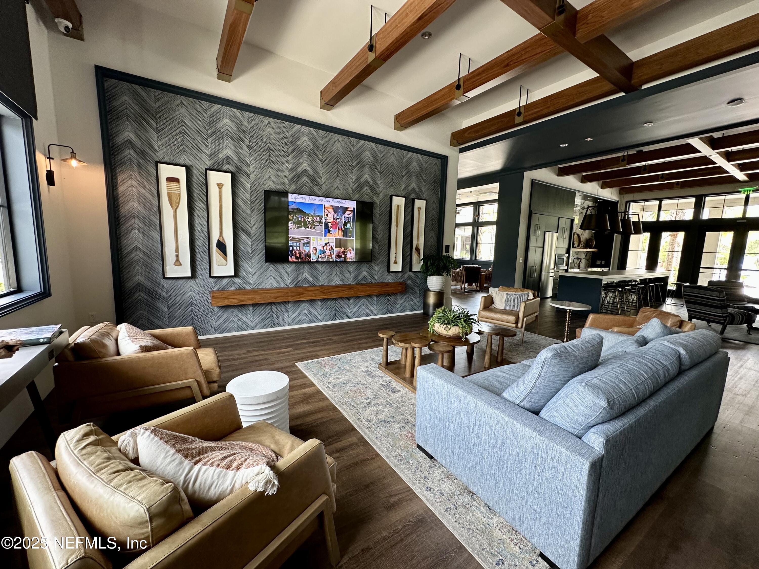 75310 White Rabbit Avenue Yulee, FL 32097 - Photo 50 of 61 a living room with furniture and a flat screen tv