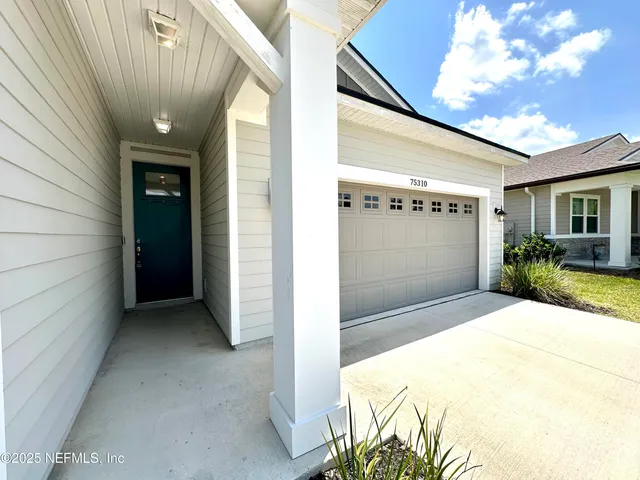 a kitchen with kitchen island granite countertop a sink a counter top space stainless steel appliances and cabinets