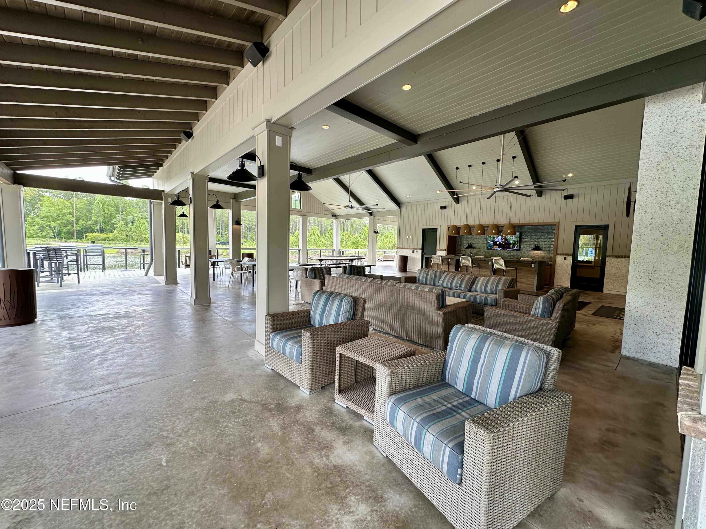 75310 White Rabbit Avenue Yulee, FL 32097 - Photo 52 of 61 a living room with furniture and wooden floors
