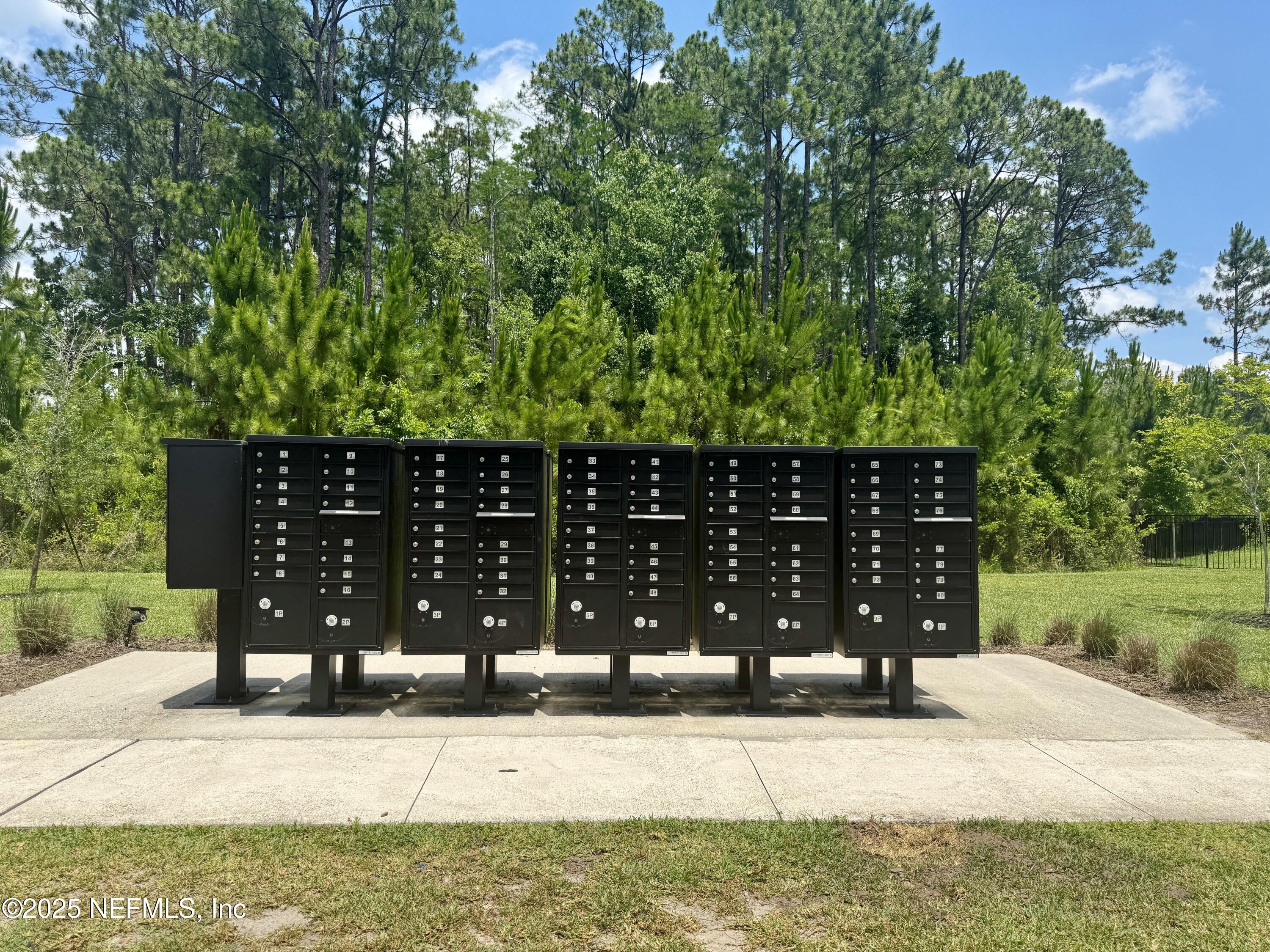 75310 White Rabbit Avenue Yulee, FL 32097 - Photo 60 of 61 a view of a house with a yard