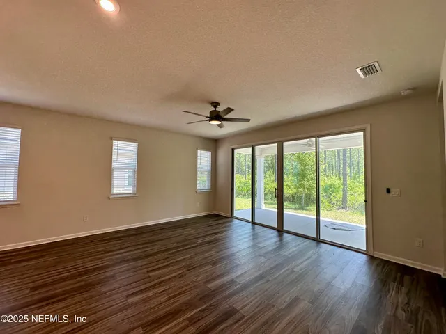 a bathroom with a double vanity sink a mirror and a shower