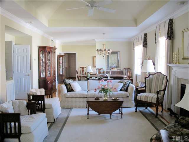3401 Barron Berkeley Way Raleigh, NC 27612 - Photo 12 of 25 a living room with furniture and a large window