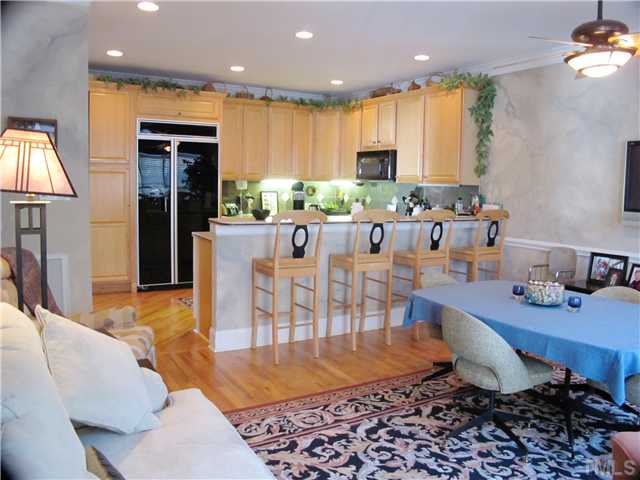 3401 Barron Berkeley Way Raleigh, NC 27612 - Photo 7 of 25 a large kitchen with a table and chairs