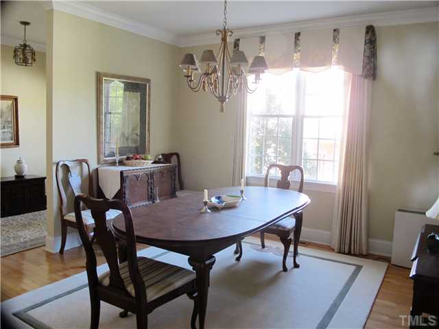 3401 Barron Berkeley Way Raleigh, NC 27612 - Photo 9 of 25 a view of a dining room with furniture window and wooden floor