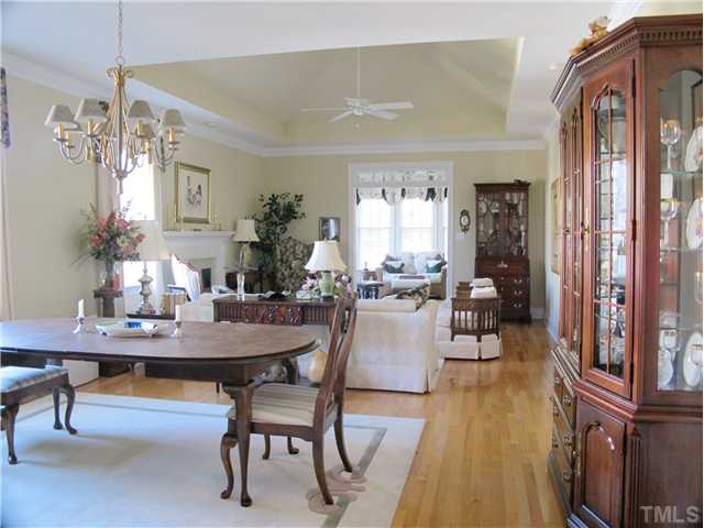 3401 Barron Berkeley Way Raleigh, NC 27612 - Photo 10 of 25 a view of a dining room with furniture and wooden floor