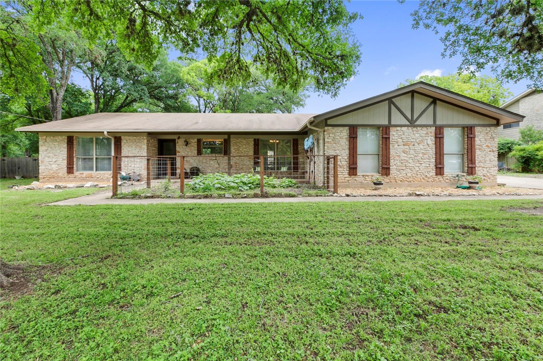 1007 Quail Road Manchaca, TX 78652 - Photo 1 of 1 a front view of a house with garden
