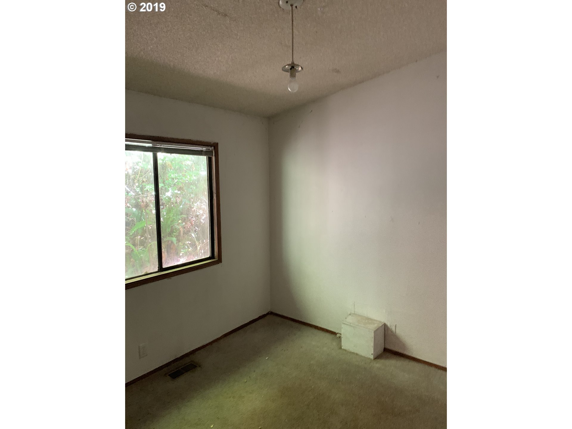 39969 Southwest Gibson Road Gaston, OR 97119 - Photo 10 of 11 a view of an empty room with a window