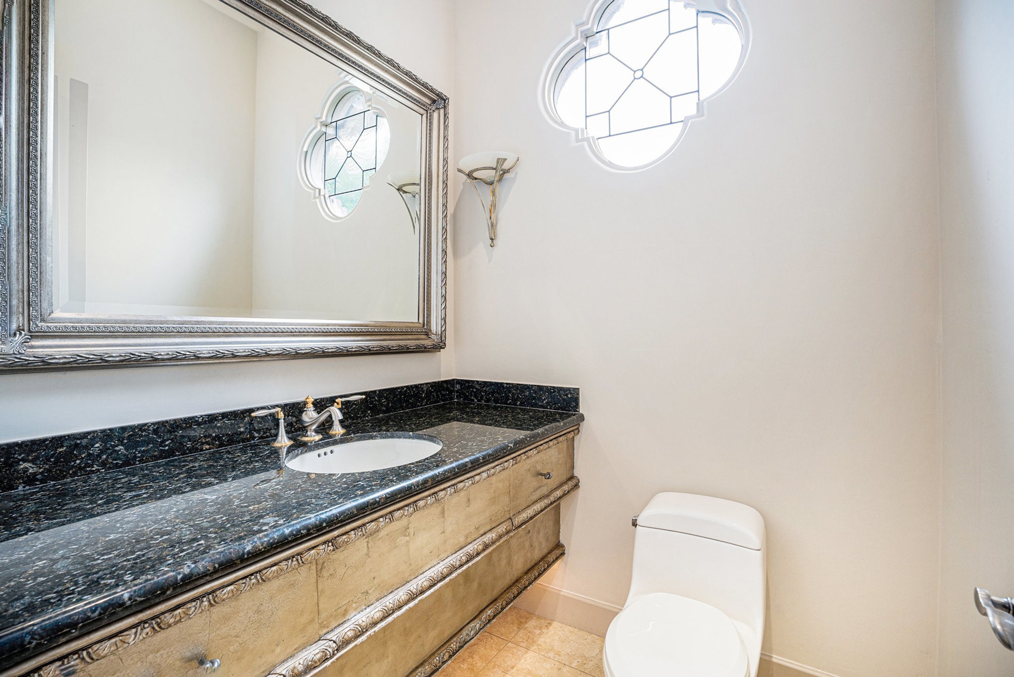 427 East Shore Drive Clear Lake Shores, TX 77565 - Photo 12 of 28 a bathroom with a granite countertop sink and a mirror