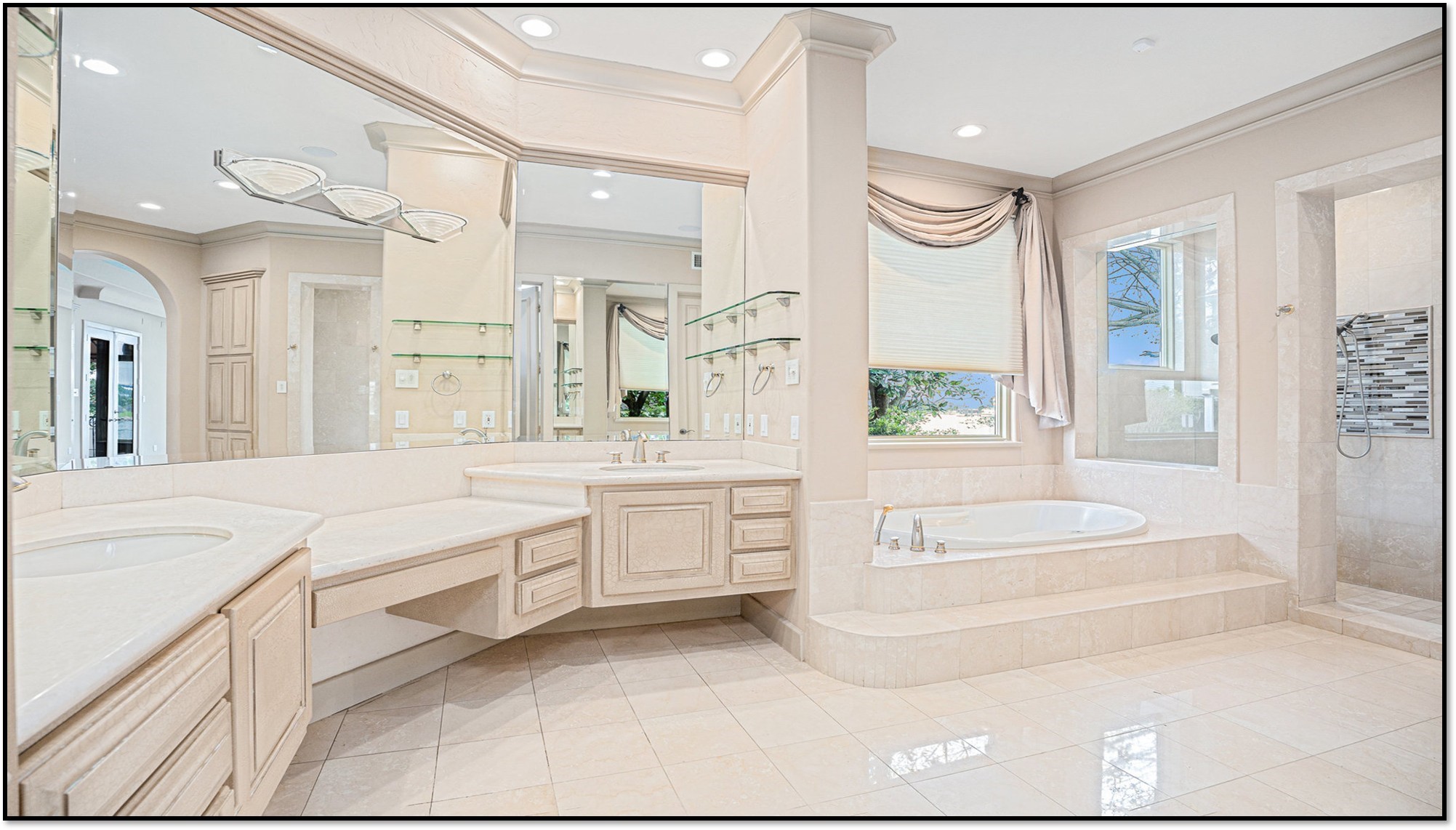 427 East Shore Drive Clear Lake Shores, TX 77565 - Photo 14 of 28 a spacious bathroom with a granite countertop sink a mirror a bathtub and next to a window