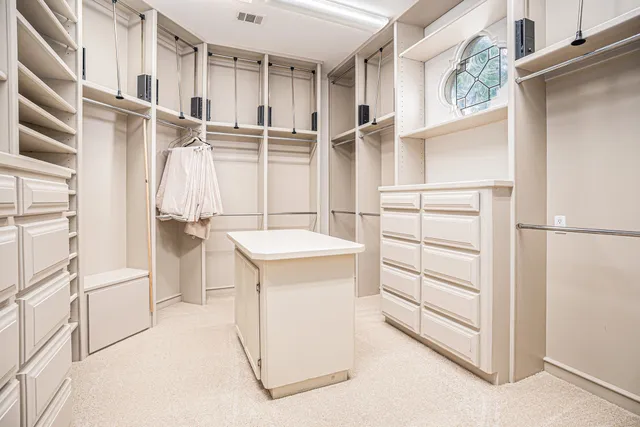 a spacious bathroom with a large tub and shower