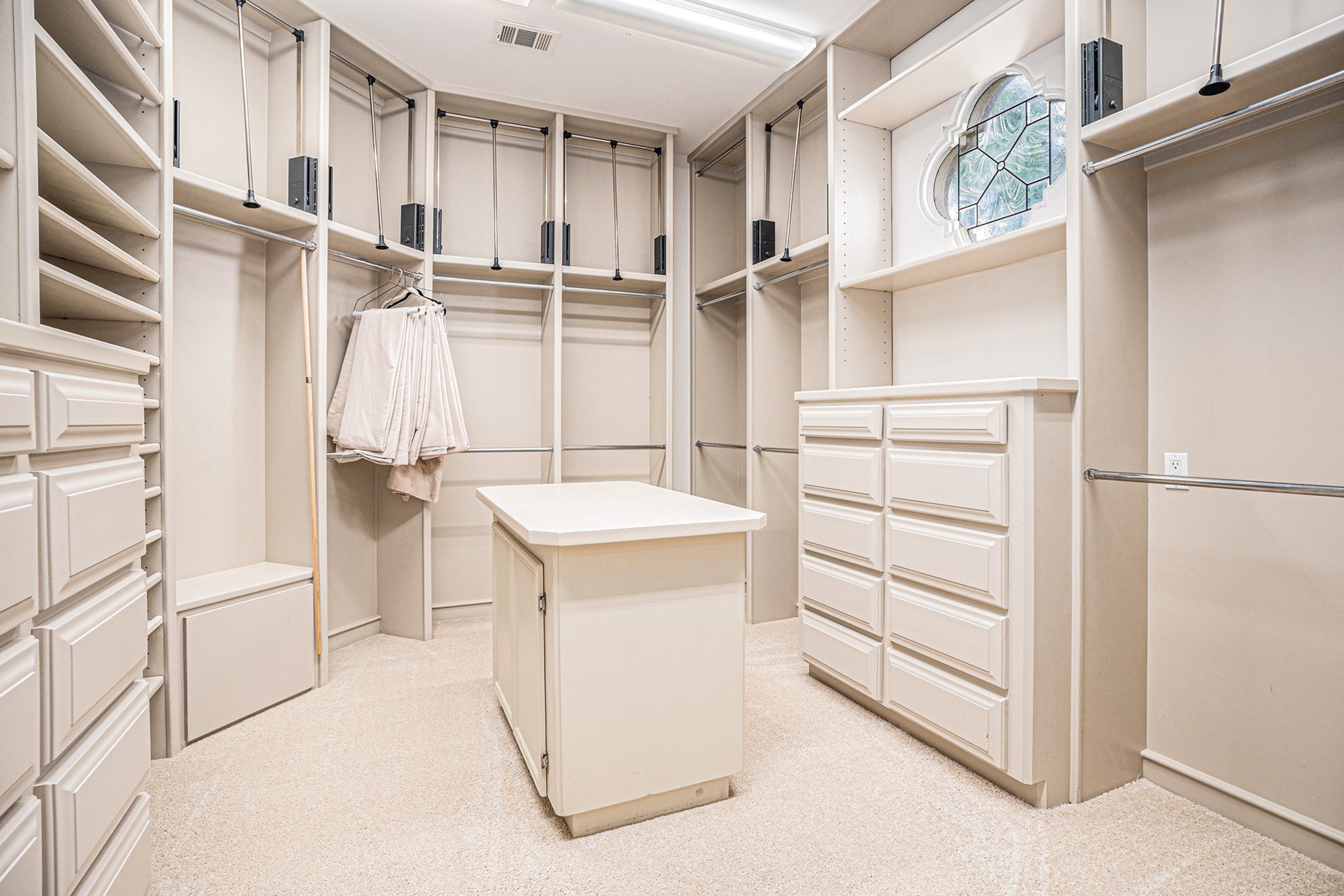 427 East Shore Drive Clear Lake Shores, TX 77565 - Photo 16 of 28 a view of walk in closet with empty racks