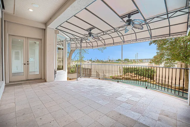 a view of a glass door with a yard