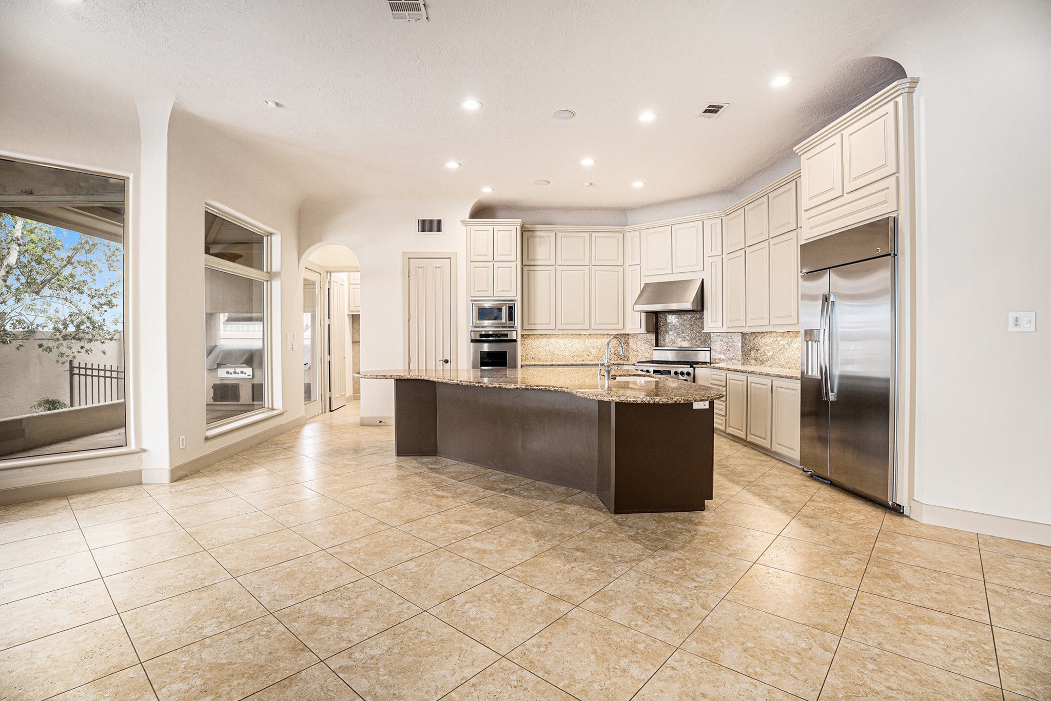 427 East Shore Drive Clear Lake Shores, TX 77565 - Photo 8 of 28 a large kitchen with a large counter top and stainless steel appliances