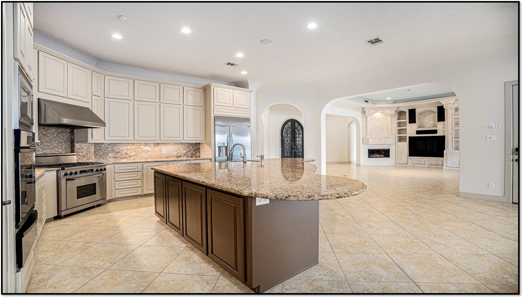 427 East Shore Drive Clear Lake Shores, TX 77565 - Photo 9 of 28 a kitchen with stainless steel appliances granite countertop a sink and cabinets