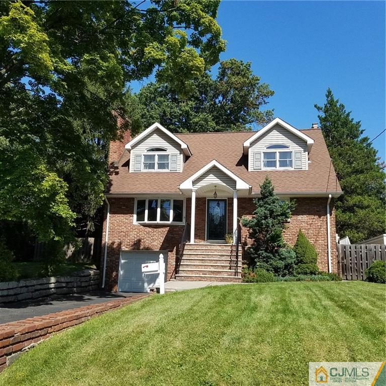 60 Morningside Road Colonia, NJ 07067 - Photo 1 of 21 a front view of a house with a yard