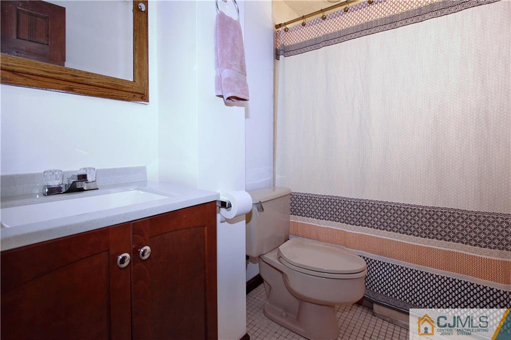 60 Morningside Road Colonia, NJ 07067 - Photo 11 of 21 a bathroom with a sink a toilet and shower