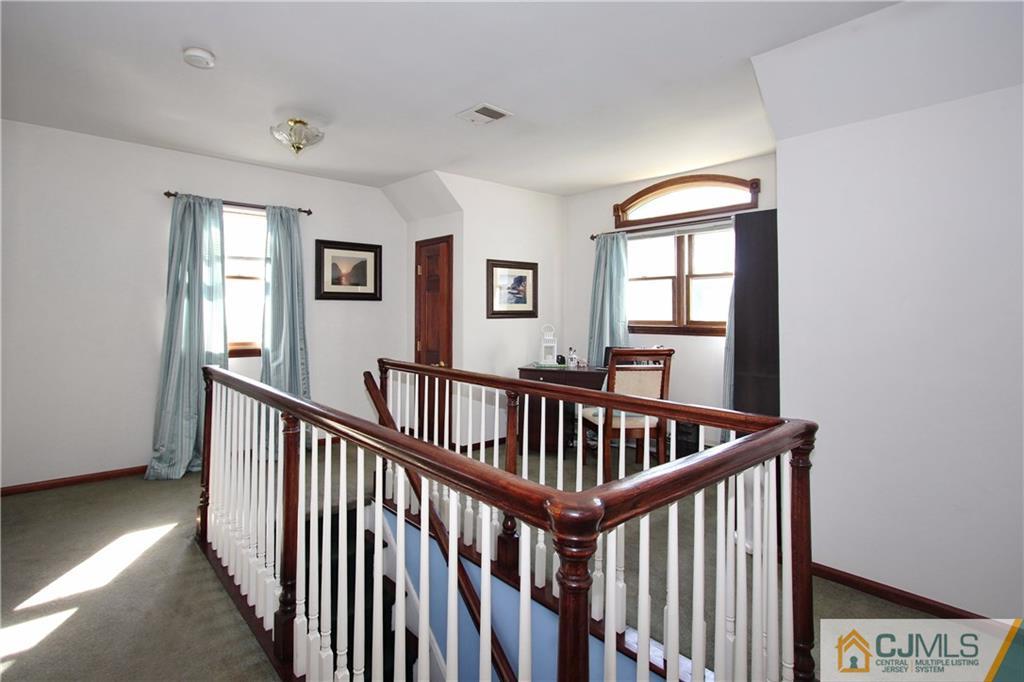 60 Morningside Road Colonia, NJ 07067 - Photo 12 of 21 a view of staircase with wooden floor and windows