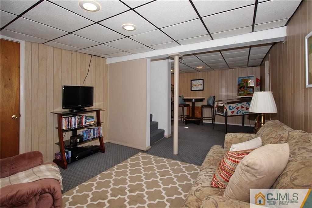 60 Morningside Road Colonia, NJ 07067 - Photo 18 of 21 a bedroom with furniture and a flat screen tv