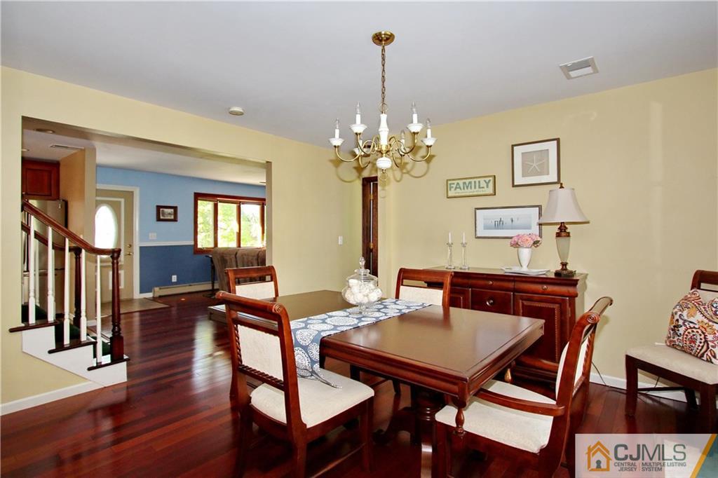 60 Morningside Road Colonia, NJ 07067 - Photo 5 of 21 a view of a dining room with furniture and a chandelier
