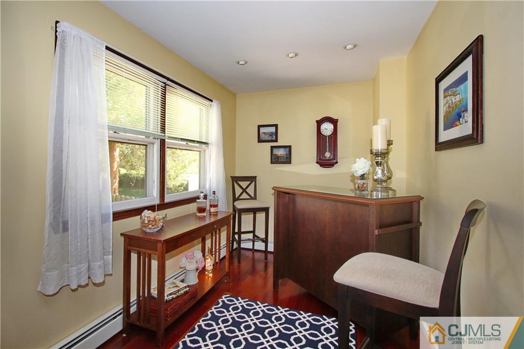 60 Morningside Road Colonia, NJ 07067 - Photo 7 of 21 a bathroom with a sink mirror bathtub and toilet