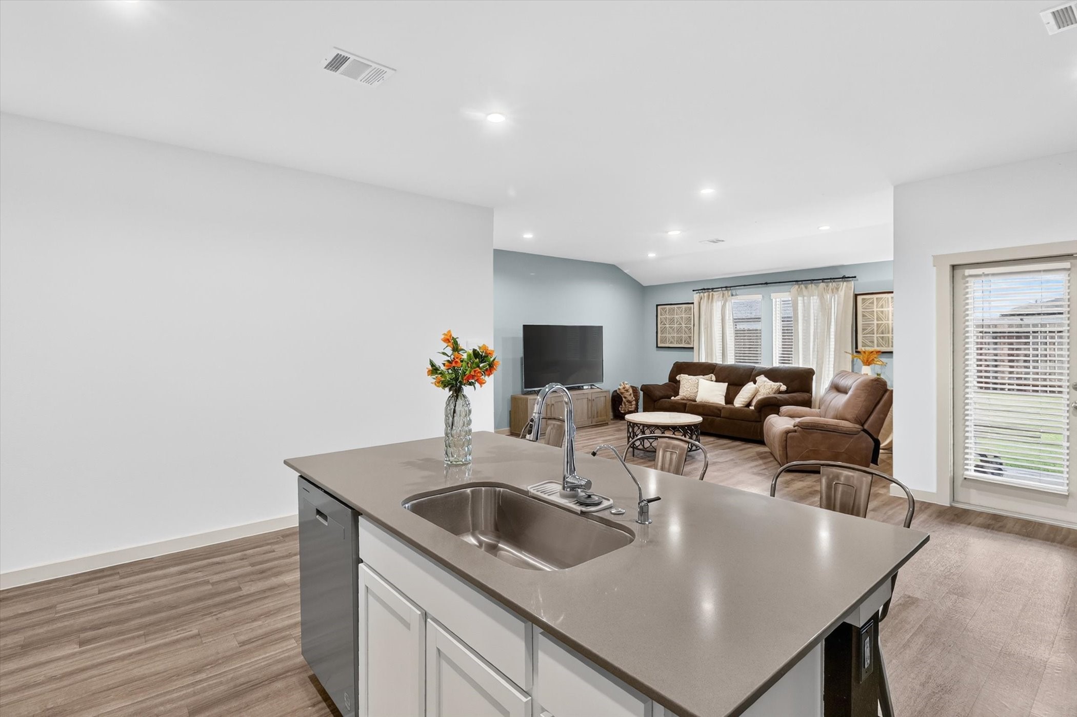 7907 Sleek Flock Lane Rosharon, TX 77583 - Photo 14 of 28 The large center island adds valuable prep space and storage, with seating that works just as well for everyday meals and entertaining as it does as a convenient workspace.