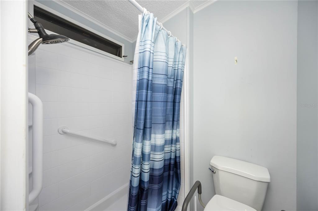 15550 Burnt Store Road, Unit 22 Punta Gorda, FL 33955 - Photo 14 of 39 a bathroom with a toilet and a shower