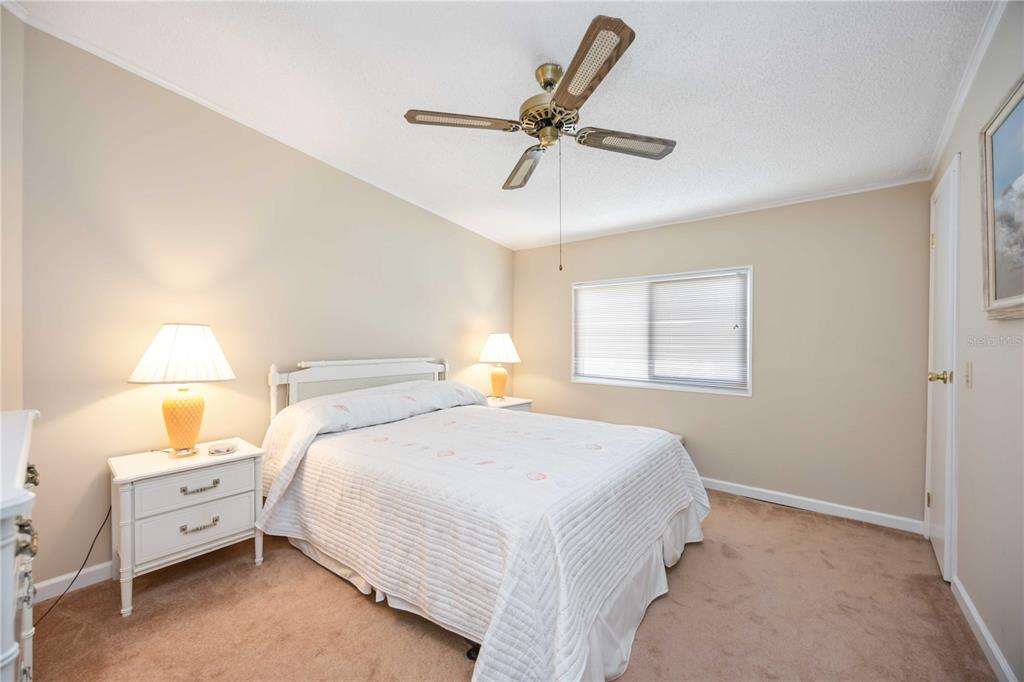 15550 Burnt Store Road, Unit 22 Punta Gorda, FL 33955 - Photo 15 of 39 a bedroom with a bed and a window