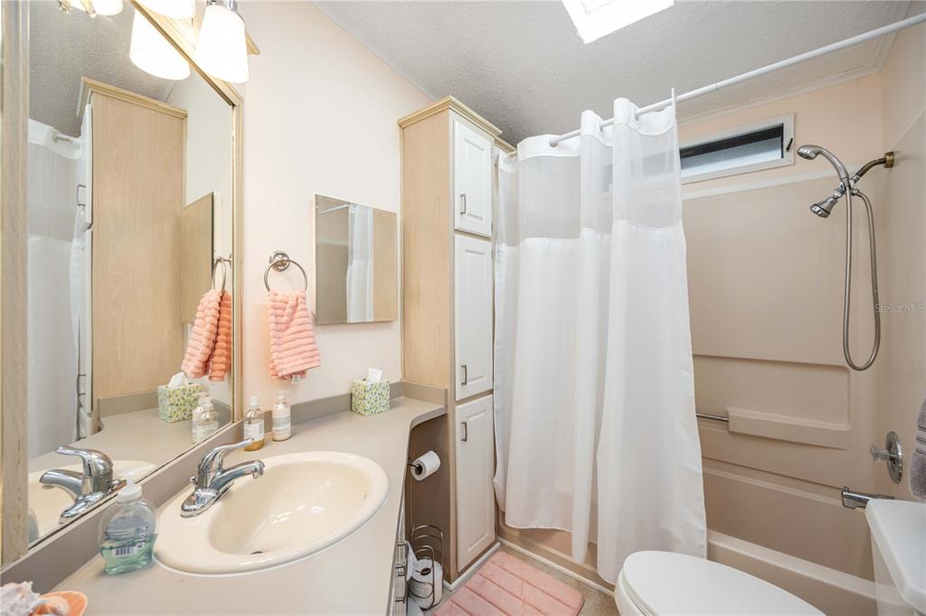 15550 Burnt Store Road, Unit 22 Punta Gorda, FL 33955 - Photo 17 of 39 a bathroom with a sink toilet and shower