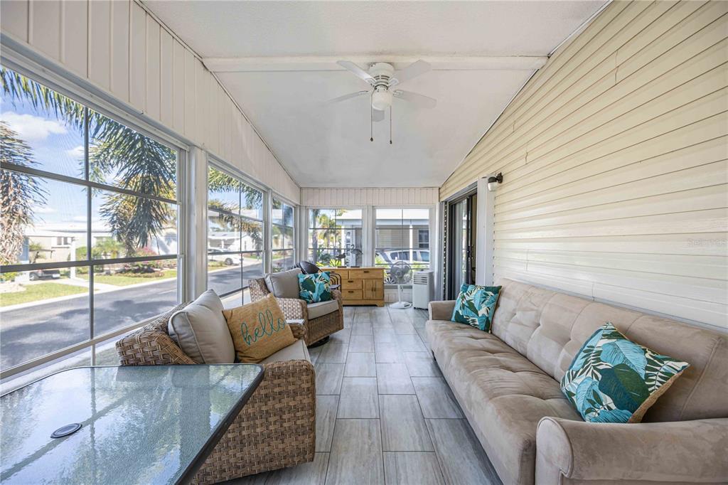 15550 Burnt Store Road, Unit 22 Punta Gorda, FL 33955 - Photo 20 of 39 a living room with furniture and a large window