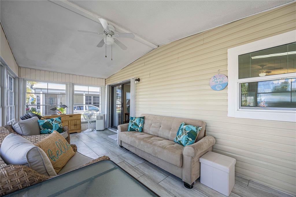 15550 Burnt Store Road, Unit 22 Punta Gorda, FL 33955 - Photo 21 of 39 a living room with furniture and a large window