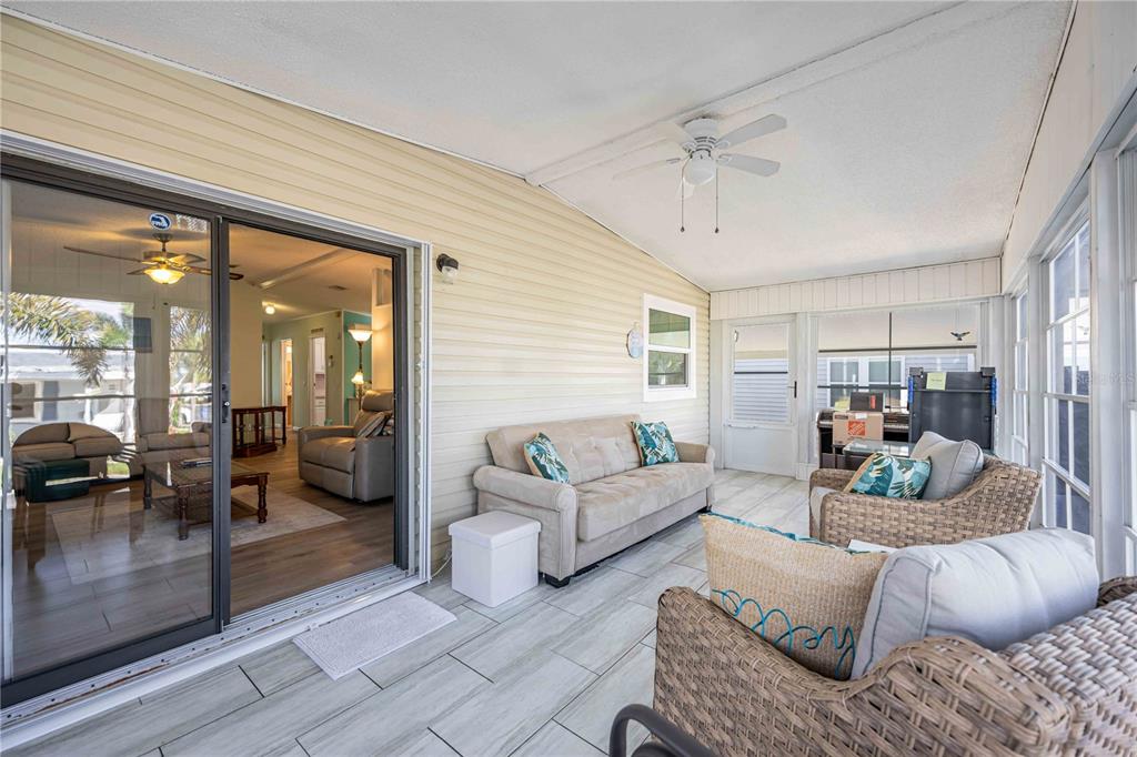 15550 Burnt Store Road, Unit 22 Punta Gorda, FL 33955 - Photo 22 of 39 a living room with furniture and a large window