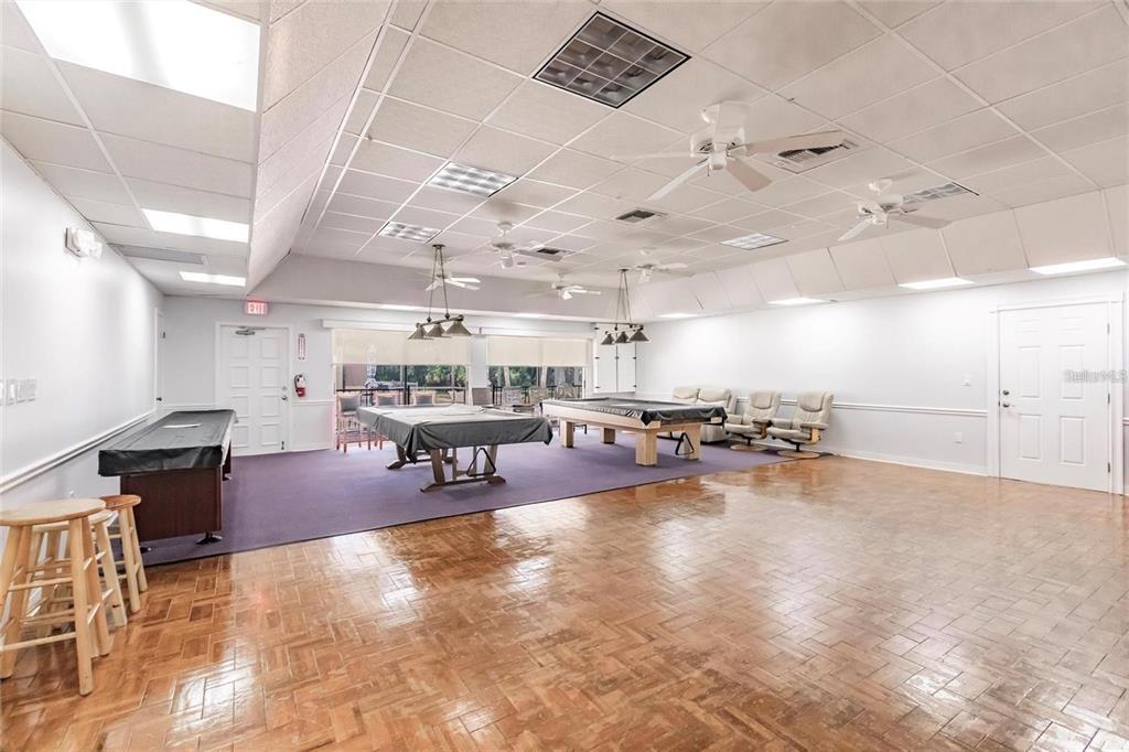 15550 Burnt Store Road, Unit 22 Punta Gorda, FL 33955 - Photo 31 of 39 a living room with lots of furniture and a table