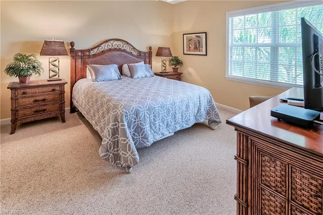 a kitchen with stainless steel appliances granite countertop a sink refrigerator and cabinets