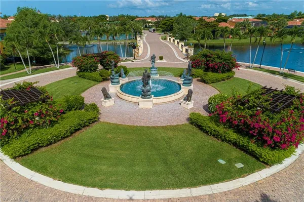 an aerial view of a house with a lake view