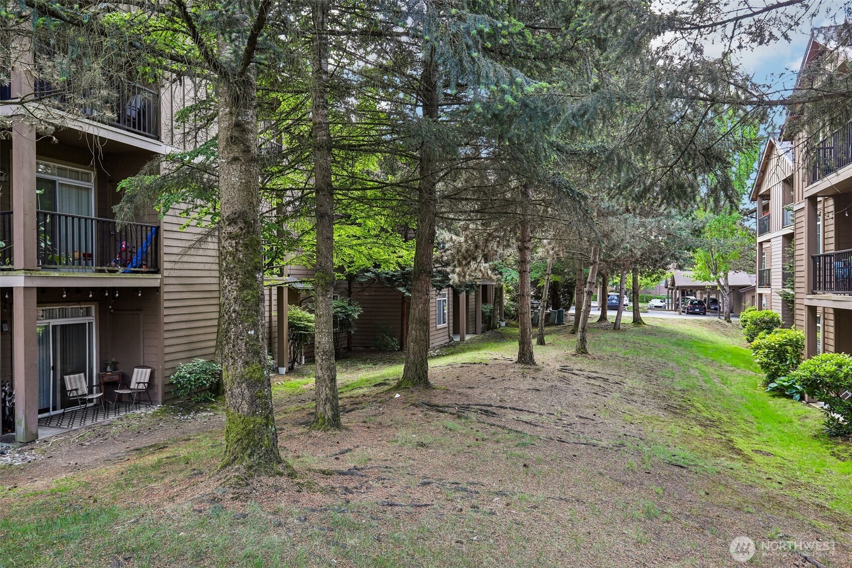 18930 Bothell Everett Highway, Unit E301 Bothell, WA 98012 - Photo 27 of 28 a ground with lots of trees and plants