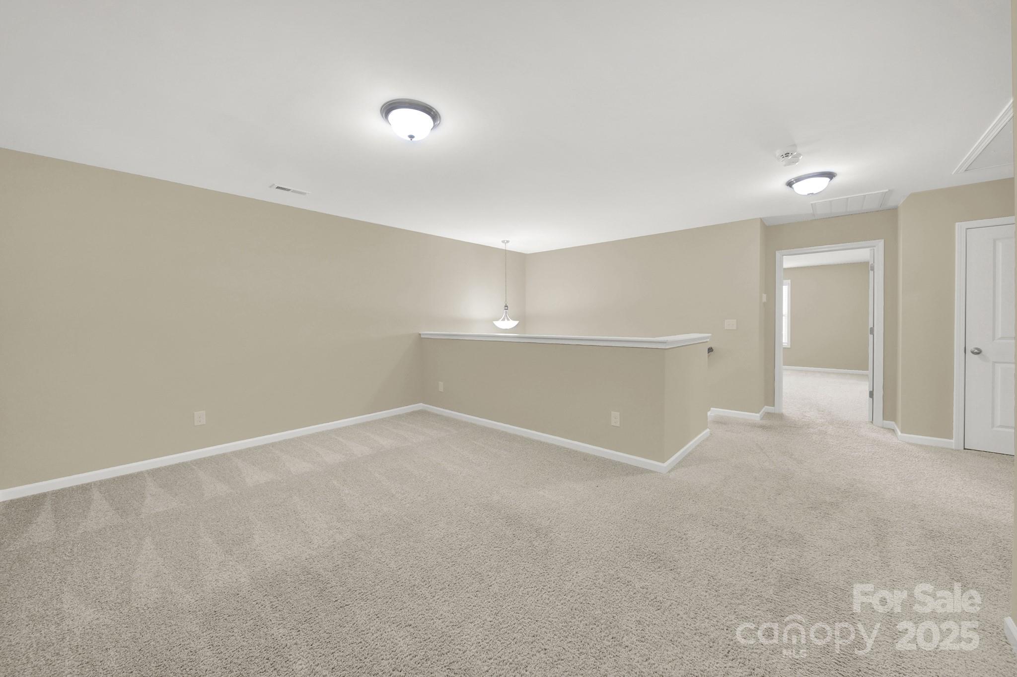 2471 Palmdale Walk Drive, Unit 107 Fort Mill, SC 29708 - Photo 18 of 30 a view of an empty room