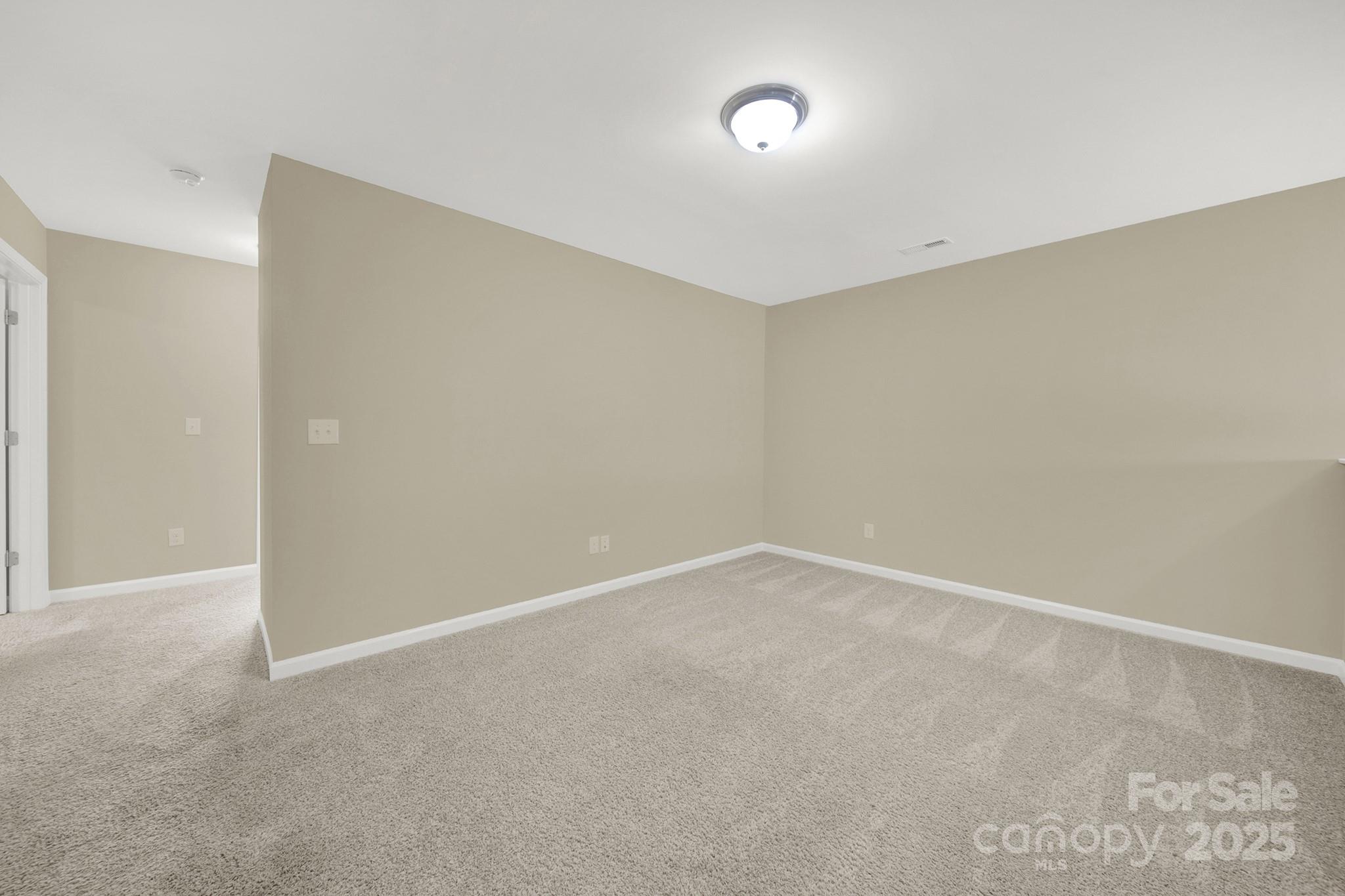 2471 Palmdale Walk Drive, Unit 107 Fort Mill, SC 29708 - Photo 19 of 30 a view of an empty room