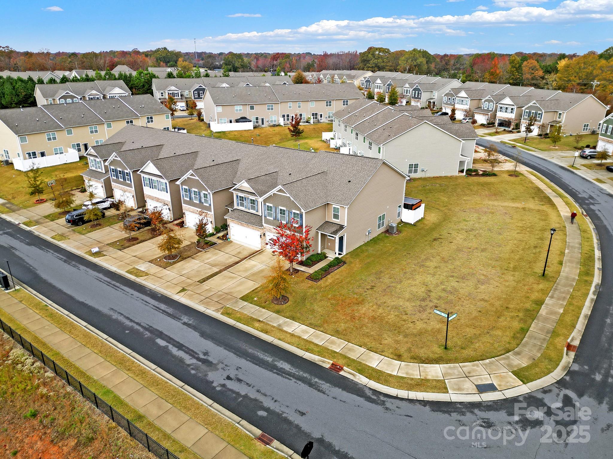 2471 Palmdale Walk Drive, Unit 107 Fort Mill, SC 29708 - Photo 2 of 30 an aerial view of residential houses with outdoor space