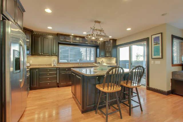 1400 Lafever Ridge Road Silver Point, TN 38582 - Photo 8 of 19 a kitchen with granite countertop a stove a refrigerator and a dining table