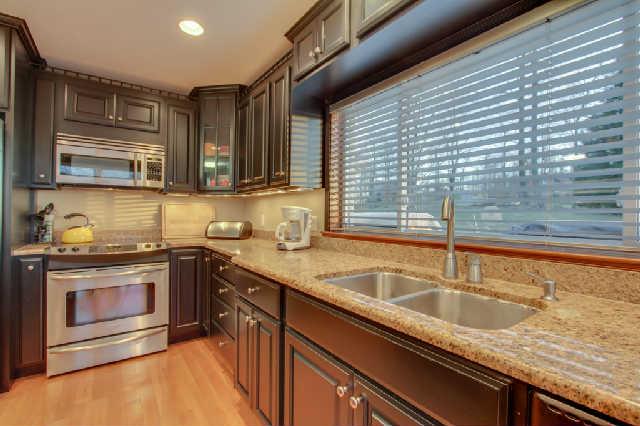 1400 Lafever Ridge Road Silver Point, TN 38582 - Photo 10 of 19 a kitchen with granite countertop a sink and a stove