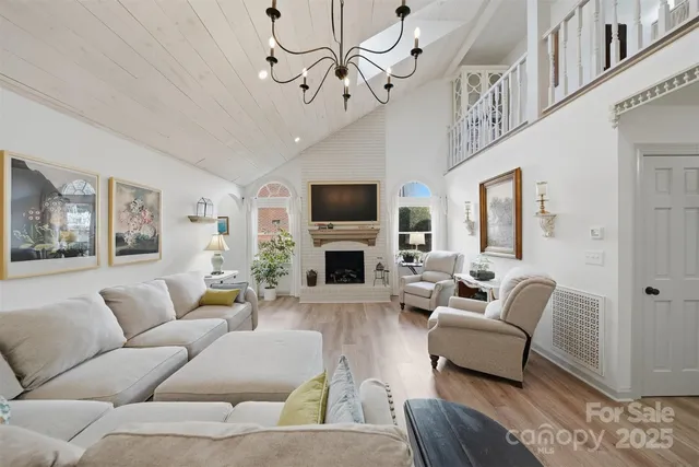 a living room with furniture fireplace and a flat screen tv
