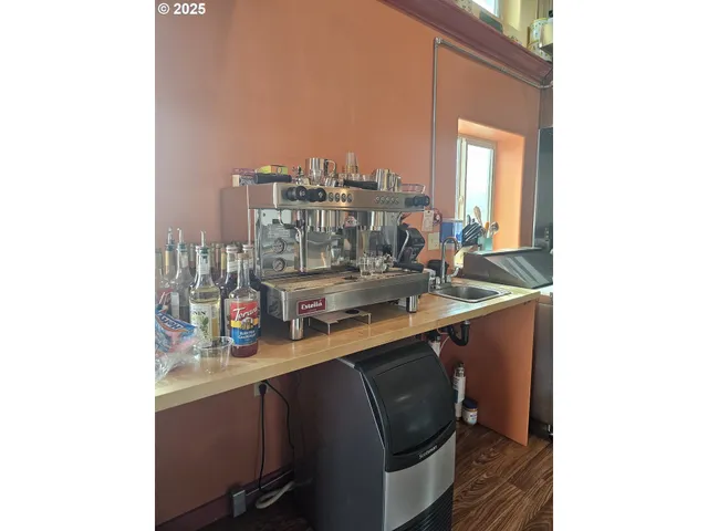 a kitchen with a sink cabinets and a window